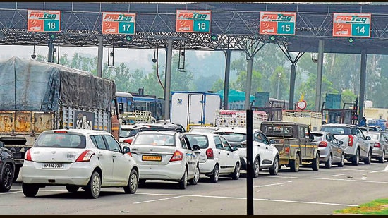Vehicles crossing from Ladhowal Toll barrier in a row after paying toll fee after the police vacated the area from farmer unions who had initiated a sit-in since June 16 against increased toll fee. (Gurpreet Singh/Hindustan Times)