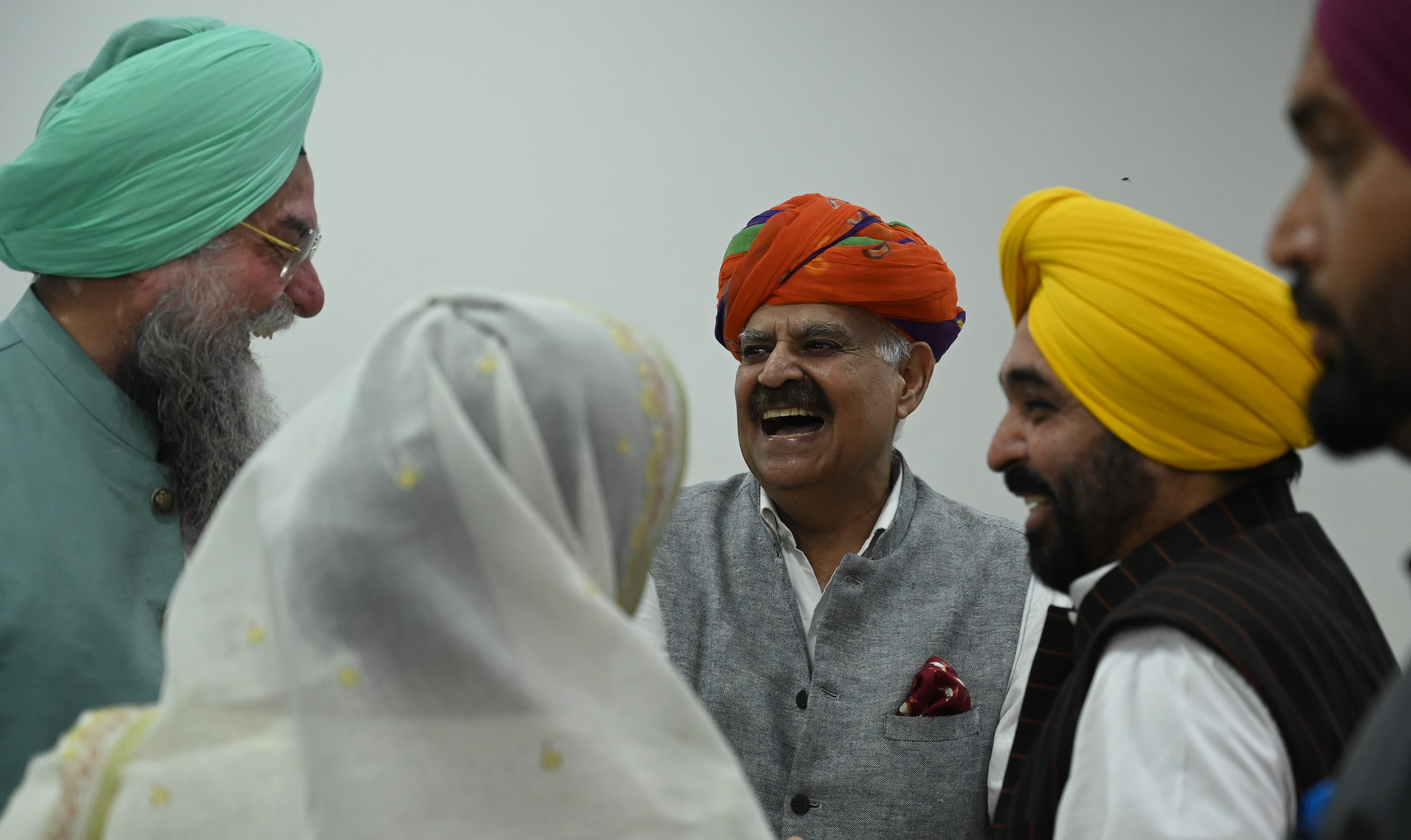 Chief minister Bhagwant Mann shares a laugh with ex-governor and UT administrator VP Singh Badnore, who attended Kataria’s swearing-in ceremony, and speaker Kultar Singh Sandhwan. Both Badnore and Kataria hail from Rajasthan (Sanjeev Sharma/HT) Chief minister Bhagwant Mann shares a laugh with ex-governor and UT administrator VP Singh Badnore, who attended Kataria’s swearing-in ceremony, and speaker Kultar Singh Sandhwan. Both Badnore and Kataria hail from Rajasthan (Sanjeev Sharma/HT)
