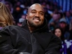 FILE - Kanye West, known as Ye, watches the first half of an NBA basketball game between the Washington Wizards and the Los Angeles Lakers, on March 11, 2022, in Los Angeles.