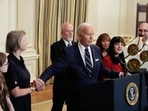 President Joe Biden holds hands with Elizabeth Whelan while delivering remarks on a prisoner swap with Russia from the State Dining Room of the White House, Thursday, Aug. 1, 2024, in Washington, as other hostage family members look on. Whelan's brother, Paul Whelan, was part of the prisoner swap. (AP /Alex Brandon) President Joe Biden holds hands with Elizabeth Whelan while delivering remarks on a prisoner swap with Russia from the State Dining Room of the White House, Thursday, Aug. 1, 2024, in Washington, as other hostage family members look on. Whelan's brother, Paul Whelan, was part of the prisoner swap. (AP /Alex Brandon)