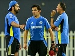 India's captain Rohit Sharma talks with head coach Gautam Gambhir (C) and chief selector Ajit Agarkar (R) during a practice session at the R. Premadasa International Cricket Stadium