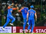 India's Washington Sundar (C) celebrates with captain Suryakumar Yadav (L)(AFP) India's Washington Sundar (C) celebrates with captain Suryakumar Yadav (L)(AFP)