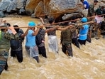 In this handout photograph taken on July 31, 2024 and released by the Indian Army, security and relief personnel conduct a search and rescue operation after landslides in Wayanad. Relentless downpours and howling winds on July 31). (Photo by INDIAN ARMY / AFP) / RESTRICTED TO EDITORIAL USE - MANDATORY CREDIT "AFP PHOTO /INDIAN ARMY" - NO MARKETING NO ADVERTISING CAMPAIGNS - DISTRIBUTED AS A SERVICE TO CLIENTS In this handout photograph taken on July 31, 2024 and released by the Indian Army, security and relief personnel conduct a search and rescue operation after landslides in Wayanad. Relentless downpours and howling winds on July 31). (Photo by INDIAN ARMY / AFP) / RESTRICTED TO EDITORIAL USE - MANDATORY CREDIT "AFP PHOTO /INDIAN ARMY" - NO MARKETING NO ADVERTISING CAMPAIGNS - DISTRIBUTED AS A SERVICE TO CLIENTS