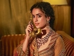 Sanya Malhotra dazzles in a coral-hued lehenga inspired by the forests of Vrindavan, designed by Sunita Rathi. This stunning piece blends art deco with elegant peacock motifs, featuring intricate hand embroidery and appliqué work for modern brides. The ensemble is complemented by jewellery from Gems and Jewels Palace, Jodhpur(Vidhi Godha)