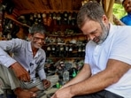 Rahul Gandhi tries his hands at shoe repairing during a short conversation with Ram Chait, a cobbler in Kurebhar near Sultanpur. He met Chait while on his way back to Lucknow from Sultanpur on Friday (ANI) Rahul Gandhi tries his hands at shoe repairing during a short conversation with Ram Chait, a cobbler in Kurebhar near Sultanpur. He met Chait while on his way back to Lucknow from Sultanpur on Friday (ANI)