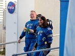 NASA astronauts Butch Wilmore and Sunita Williams walk at NASA's Kennedy Space Center, ahead of Boeing's Starliner-1 Crew Flight Test (CFT) mission on a United Launch Alliance Atlas V rocket to the International Space Station, in Cape Canaveral, Florida, U.S., June 5, 2024. 