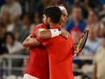 Spain's Rafael Nadal (R) and Spain's Carlos Alcaraz (L) embrace after losing their men's doubles quarter-final tennis match on Court Philippe-Chatrier at the Roland-Garros Stadium during the Paris 2024 Olympics(AFP) Spain's Rafael Nadal (R) and Spain's Carlos Alcaraz (L) embrace after losing their men's doubles quarter-final tennis match on Court Philippe-Chatrier at the Roland-Garros Stadium during the Paris 2024 Olympics(AFP)