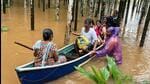 Rescue officials help stranded people in the flooded Uttara Kannada district on Thursday (HT Photo) Rescue officials help stranded people in the flooded Uttara Kannada district on Thursday (HT Photo)