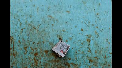 A birthday greeting card hangs on a wall of a destroyed home, covered with mud stains after several landslides hit the hills in Wayanad district. (REUTERS) A birthday greeting card hangs on a wall of a destroyed home, covered with mud stains after several landslides hit the hills in Wayanad district. (REUTERS)