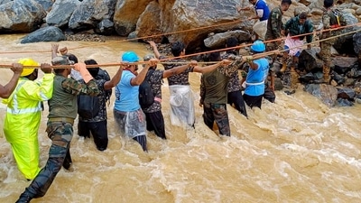 In this handout photograph taken on July 31, 2024 and released by the Indian Army, security and relief personnel conduct a search and rescue operation after landslides in Wayanad. Relentless downpours and howling winds on July 31). (Photo by INDIAN ARMY / AFP) / RESTRICTED TO EDITORIAL USE - MANDATORY CREDIT "AFP PHOTO /INDIAN ARMY" - NO MARKETING NO ADVERTISING CAMPAIGNS - DISTRIBUTED AS A SERVICE TO CLIENTS In this handout photograph taken on July 31, 2024 and released by the Indian Army, security and relief personnel conduct a search and rescue operation after landslides in Wayanad. Relentless downpours and howling winds on July 31). (Photo by INDIAN ARMY / AFP) / RESTRICTED TO EDITORIAL USE - MANDATORY CREDIT "AFP PHOTO /INDIAN ARMY" - NO MARKETING NO ADVERTISING CAMPAIGNS - DISTRIBUTED AS A SERVICE TO CLIENTS