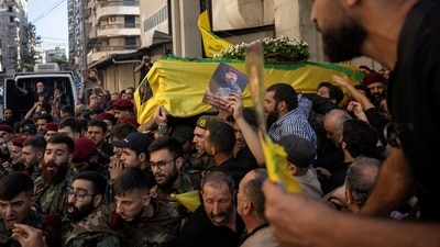Members of Hezbollah carry the coffin of Fuad Shukr, a senior Hezbollah commander who was killed by an Israeli strike on Tuesday, during his funeral in Beirut's southern suburbs, Lebanon August 1, 2024. REUTERS (REUTERS)