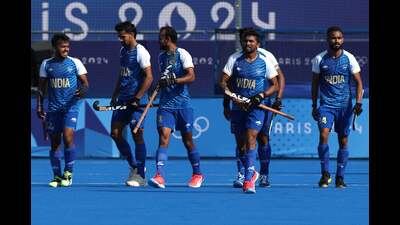 India's players celebrate their team's first goal in the men's pool B hockey match against Belgium, in Paris on Thursday. (AFP) India's players celebrate their team's first goal in the men's pool B hockey match against Belgium, in Paris on Thursday. (AFP)