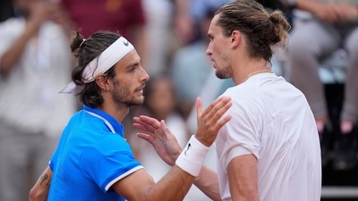 Lorenzo Musetti of Italy is greeted by Alexander Zverev of Germany (AP)