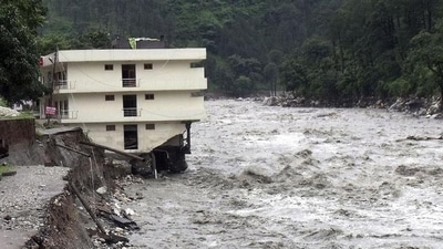 Part of a three storey building is washed away in flash floods in the Uttarkashi district, Uttarakhand. (AP/FILE) Part of a three storey building is washed away in flash floods in the Uttarkashi district, Uttarakhand. (AP/FILE)
