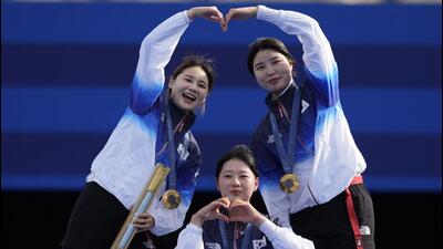 South Korean gold medallists Jeon Hun-young, left, Lim Si-hyeon, centre, Nam Su-hyeon, right, celebrate during women's team medal ceremony at the Paris Olympics on Sunday. (AP) South Korean gold medallists Jeon Hun-young, left, Lim Si-hyeon, centre, Nam Su-hyeon, right, celebrate during women's team medal ceremony at the Paris Olympics on Sunday. (AP)