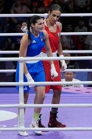 Algeria's Imane Khelif, red, next to Italy's Angela Carini, at the end of their women's 66kg preliminary boxing match at the 2024 Summer Olympics (AP) Algeria's Imane Khelif, red, next to Italy's Angela Carini, at the end of their women's 66kg preliminary boxing match at the 2024 Summer Olympics (AP)