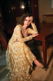 Actor Sanya Malhotra shines in a co-ord set from Moledro that features a hand-embroidered cowl-neck blouse. Paired with fluid pants adorned with floral motifs, the ensemble is sure to make a statement at after-parties. The look has been accessorised with a diamond necklace set in gold from CaratLane for timeless allure (Vidhi Godha) Actor Sanya Malhotra shines in a co-ord set from Moledro that features a hand-embroidered cowl-neck blouse. Paired with fluid pants adorned with floral motifs, the ensemble is sure to make a statement at after-parties. The look has been accessorised with a diamond necklace set in gold from CaratLane for timeless allure (Vidhi Godha)
