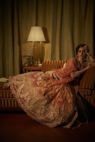 Sanya looks resplendent in a coral-hued Sunita Rathi lehenga, inspired by the forests of Vrindavan. A fusion of art deco and peacock motifs, along hand kadhai and appliqué work beautifully come together to create a sophisticated piece for modern brides. The look has been paired with a jadau necklace with rubies, diamonds and white and gold enamel from Gems & Jewels Palace, Jodhpur. The jeweller will be part of the FDCI Manifest Wedding Weekend on August 3 and 4 at Taj Palace Hotel, New Delhi (Vidhi Godha) Sanya looks resplendent in a coral-hued Sunita Rathi lehenga, inspired by the forests of Vrindavan. A fusion of art deco and peacock motifs, along hand kadhai and appliqué work beautifully come together to create a sophisticated piece for modern brides. The look has been paired with a jadau necklace with rubies, diamonds and white and gold enamel from Gems & Jewels Palace, Jodhpur. The jeweller will be part of the FDCI Manifest Wedding Weekend on August 3 and 4 at Taj Palace Hotel, New Delhi (Vidhi Godha)