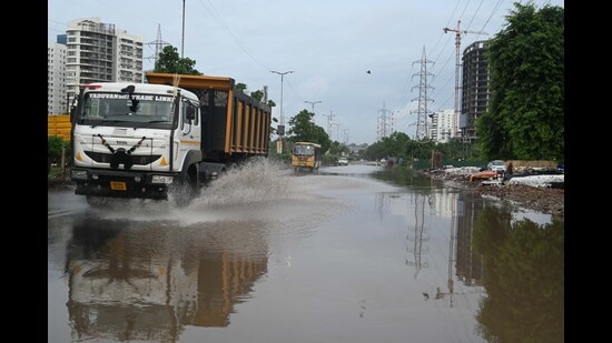 A waterlogged road in Sector 66 of Gurugram on Thursday. (Parveen Kumar/HT)