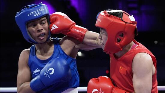 China's Wu Yu, right, fights Nikhat in their women's 50kg bout at the Paris Olympics on Thursday. (AP)