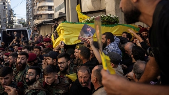 Members of Hezbollah carry the coffin of Fuad Shukr, a senior Hezbollah commander who was killed by an Israeli strike on Tuesday, during his funeral in Beirut's southern suburbs, Lebanon August 1, 2024. REUTERS(REUTERS)