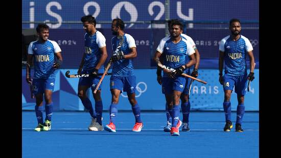 India's players celebrate their team's first goal in the men's pool B hockey match against Belgium, in Paris on Thursday. (AFP)