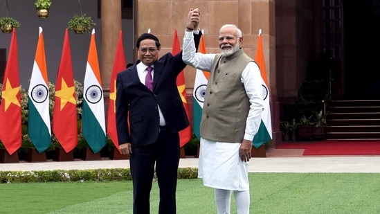 Prime Minister Narendra Modi and Vietnam Prime Minister Ph?m Minh Chinh hold hands as they meet at Hyderabad House in New Delhi August 1.(ANI)