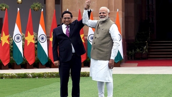 Prime Minister Narendra Modi and Vietnam Prime Minister Ph?m Minh Chinh hold hands as they meet at Hyderabad House, in New Delhi on Thursday. (ANI Photo/Rahul Singh)(Rahul Singh)