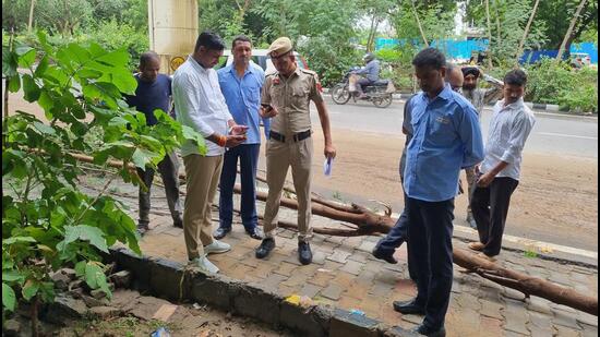 Officials on August Kranti Marg near Iffco Chowk in Gurugram where the incident took place. (Parveen Yadav/ HT Photo)