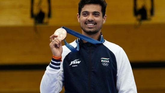 India's Swapnil Kusale celebrates after winning the bronze medal in the 50m rifle 3 positions men's final at the 2024 Summer Olympics, Thursday, Aug. 1, 2024, in Chateauroux, France. (AP Photo/Manish Swarup)(AP)