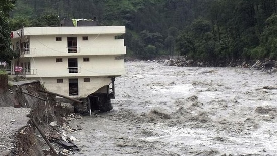 Part of a three storey building is washed away in flash floods in the Uttarkashi district, Uttarakhand. (AP/FILE)