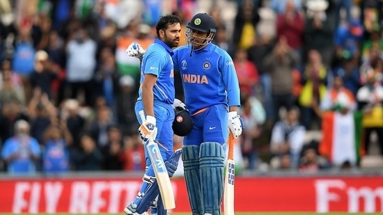 Rohit Sharma (L) and MS Dhoni during the 2019 World Cup(Getty)