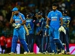 India's Arshdeep Singh (R) and Mohammed Siraj (L) walks back to the pavilion after the first one-day international (ODI) cricket match between Sri Lanka and India at the R. Premadasa International Cricket Stadium