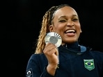 Second-placed Brazil's Rebeca Andrade celebrates during the podium ceremony after the artistic gymnastics women's all around final during the Paris 2024 Olympic Games at the Bercy Arena in Paris