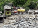 Houses after some part washed away in the river following a flood caused by a cloudburst, at the Baladhi village in Kullu on Thursday. (ANI)(HT_PRINT) Houses after some part washed away in the river following a flood caused by a cloudburst, at the Baladhi village in Kullu on Thursday. (ANI)(HT_PRINT)