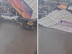 This image shows a huge hoarding on top of a few parked vehicles in Thane, near Mumbai. This image shows a huge hoarding on top of a few parked vehicles in Thane, near Mumbai.