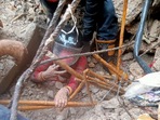 Woman being rescued from the rubble after a building collapsed in Delhi's Jahangirpuri area on Friday afternoon.(via HT ) Woman being rescued from the rubble after a building collapsed in Delhi's Jahangirpuri area on Friday afternoon.(via HT )