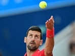 Serbia's Novak Djokovic serves to Italy's Lorenzo Musetti during their men's singles semi-final tennis match on Court Philippe-Chatrier at the Roland-Garros Stadium during the Paris 2024 Olympic Games= Serbia's Novak Djokovic serves to Italy's Lorenzo Musetti during their men's singles semi-final tennis match on Court Philippe-Chatrier at the Roland-Garros Stadium during the Paris 2024 Olympic Games=