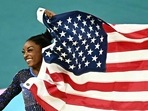 TOPSHOT - US' Simone Biles celebrates winning the gold medal at the end of the artistic gymnastics women's all around final of the Paris 2024 Olympic Games at the Bercy Arena in Paris, on August 1, 2024. (AFP / Gabriel Bouys) TOPSHOT - US' Simone Biles celebrates winning the gold medal at the end of the artistic gymnastics women's all around final of the Paris 2024 Olympic Games at the Bercy Arena in Paris, on August 1, 2024. (AFP / Gabriel Bouys)
