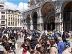 Tourists walk in St Mark's Square on the day Venice municipality introduces a new fee for day-trippers in a move to preserve the lagoon city often crammed with tourists. (Reuters) Tourists walk in St Mark's Square on the day Venice municipality introduces a new fee for day-trippers in a move to preserve the lagoon city often crammed with tourists. (Reuters)