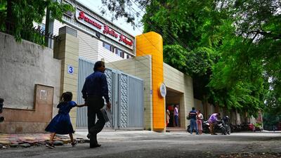 A student is sent home with her guardian on Friday morning. (Vipin Kumar/HT Photo) A student is sent home with her guardian on Friday morning. (Vipin Kumar/HT Photo)