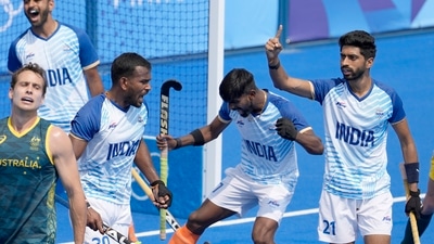 Indian players celebrate after the side clinched a historic first win over Australia in men's hockey at the Olympics in 52 years. (AP) Indian players celebrate after the side clinched a historic first win over Australia in men's hockey at the Olympics in 52 years. (AP)