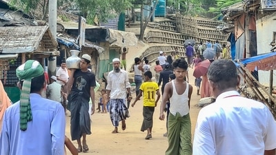 This photo taken on May 24, 2024 shows Rohingya refugees walking down a path at a Rohingya refugee camp in Ukhia in Bangladesh's southeastern Cox's Bazar district. (AFP) This photo taken on May 24, 2024 shows Rohingya refugees walking down a path at a Rohingya refugee camp in Ukhia in Bangladesh's southeastern Cox's Bazar district. (AFP)