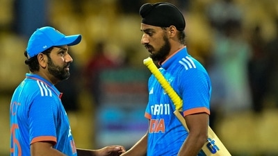 India's captain Rohit Sharma (L) shakes hands with Arshdeep Singh (R) after the match (AFP)