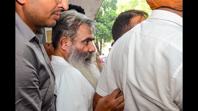 Former Congress minister Bharat Bhushan Ashu being taken to a court in Jalandhar on Friday. (PTI) Former Congress minister Bharat Bhushan Ashu being taken to a court in Jalandhar on Friday. (PTI)