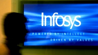 A man walks past a billboard of Infosys Technologies Ltd's office in Bangalore. (Reuters)