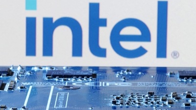 Intel layoffs: Intel logo is seen near computer motherboard. (Reuters)
