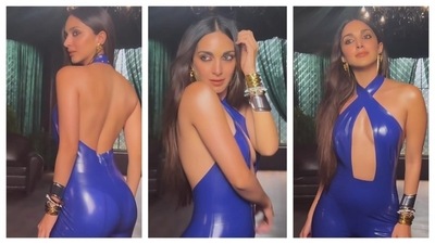 Kiara Advani turned heads in this latex backless, blue bodysuit. She paired the form-fitting dress with a contrasting golden-silver bracelet and a pair of golden dangling earrings. (Instagram/@kiaraaliaadvani) Kiara Advani turned heads in this latex backless, blue bodysuit. She paired the form-fitting dress with a contrasting golden-silver bracelet and a pair of golden dangling earrings. (Instagram/@kiaraaliaadvani)