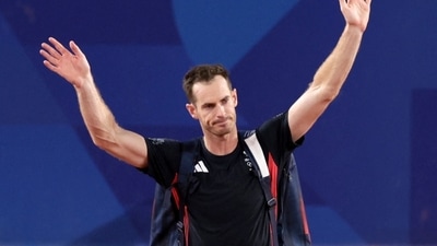 Andy Murray of Britain waves to spectators. (REUTERS)