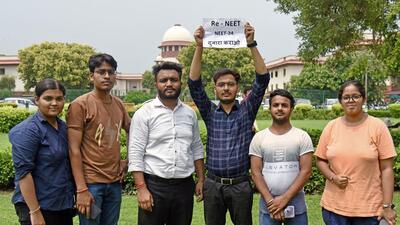 Petitioner students wait outside as the hearing is going on regarding the alleged irregularities in NEET UG 2024 in the Supreme Court, in New Delhi. (ANI)